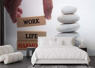 Work life harmony text on wooden blocks with zen stones background. Business working culture concept. Wall mural