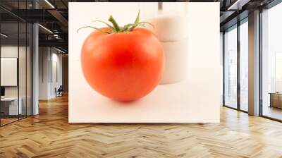 one unpeeled, fresh, red tomato with green tail on white background Wall mural