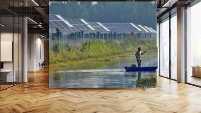 Asian fishermen rowing in the rivers of the solar photovoltaic district Wall mural