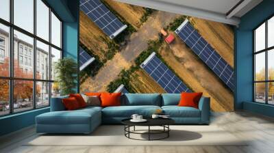 Farm tractor driving through solar photovoltaic area Wall mural