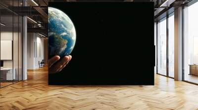 Panoramic - man with the world with his hands on black background - elements of this image furnished by NASA Wall mural