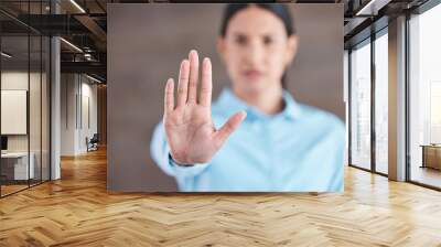 Stop, hand sign and woman with no gesture for sexual harassment and violence in workplace. Business professional, palm and female employee at company with stopping emoji for gender rights at job Wall mural