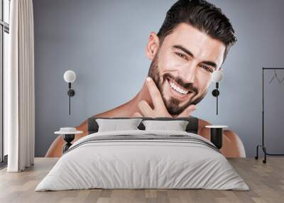 Skincare, teeth and health, portrait of man with smile, hands on face and beard or dental maintenance. Fitness, spa facial care, happy male model with muscle in studio isolated on grey background. Wall mural