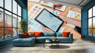 Tablet, paper charts and research for planning, startup company and reading for business process. Brainstorming, digital device and analysis for projections, idea strategy or group project innovation Wall mural