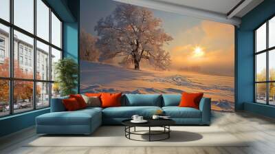 The image captures a serene winter landscape at sunrise or sunset. A single, prominent tree, enveloped in frost and bathed in golden light, stands out against a glowing sky with soft clouds. The tree' Wall mural