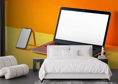 Laptop and smartphone isolated on yellow and orange gradient background. 3D rendering of laptop with copy space. Side view of notebook and phone with white screens Wall mural