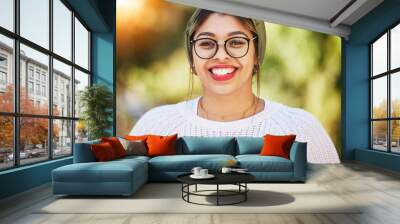 Young woman, smile and happy portrait outdoor in nature with glasses and bright smile in summer. Fashion, style and gen z female model or student with a turban scarf, happiness and positive mindset Wall mural