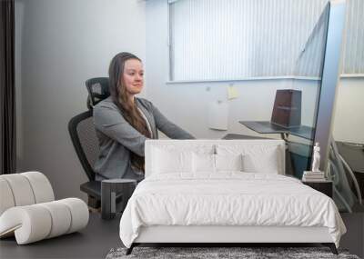 Woman working from home in her ergonomic office. Wall mural