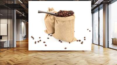 Coffee beans. Two jute burlack sacks with hard roasted coffee beans and coffee spatula, isolated on white background. Wall mural