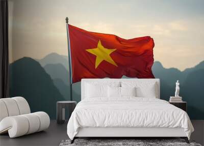 Vietnam National Flag, High quality photo of Vietnam National Flag flying in Ha Long, Vietnam at dawn with rolling hills and mountains in the background Wall mural