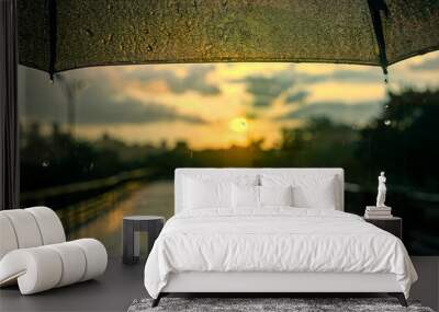 Under the umbrella, in the rain, with the sun straight in the front POV Wall mural