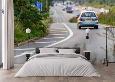 car moving towards uk motorway on junction exit in england Wall mural