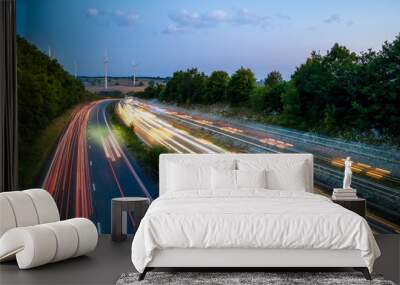 heavy traffic moving at speed on UK motorway in England at sunset Wall mural