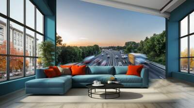 Sunset view heavy traffic moving at speed on UK motorway in England Wall mural