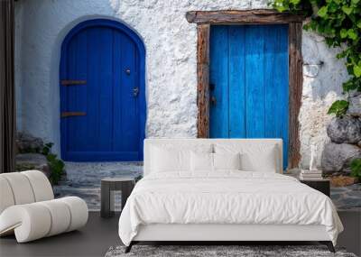  A blue door on a white building Stone path leads to both Wall mural