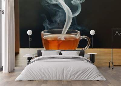  a cup of tea on a saucer with steam coming out of the top of the cup and on a saucer with a spoon in front of the cup. Wall mural