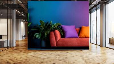  A livable space featuring a couch, lush potted plants, and a radiant neon sign above Wall mural