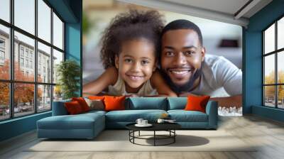  a man and a little girl laying on top of a rug on the floor in a living room with a rug on the floor and a white rug on the floor. Wall mural