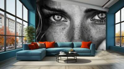  A monochrome image of a woman's face featuring freckled hair and eyes Wall mural