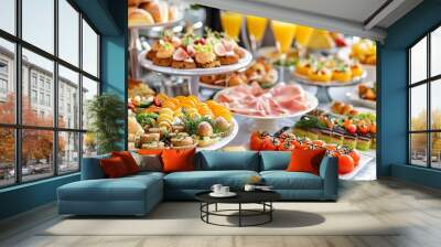  A table laden with plates of food and two glasses of orange juice Wall mural