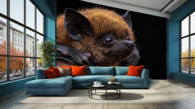  A tight shot of a bat perched on a tree branch, its mouth agape and eyes wide Wall mural