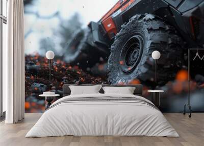  A tight shot of an off-road vehicle navigating a forest littered with rocks and vibrant orange firecrackers Wall mural