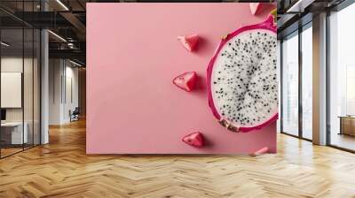   Dragon fruit in half on pink surface with fruits in middle Wall mural