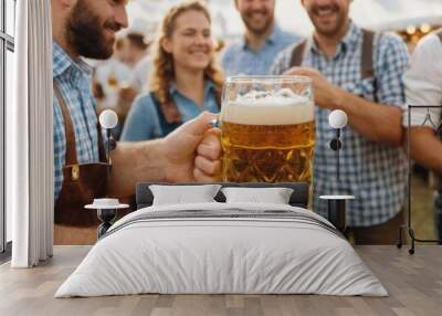  The image shows a group of people gathered around in a field, holding up large beer steins. Among the group, there is a man wearing. Wall mural