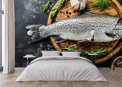 a fish sitting on top of a wooden cutting board next to a bowl of spices and a pepper shaker. Wall mural