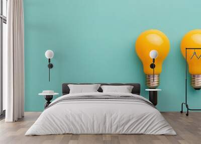 Two Yellow Light Bulbs on a Pastel Green Background Representing Bright Ideas, Innovation, and Energy Efficiency Wall mural