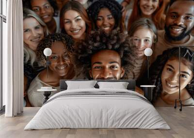 A large diverse group of people, including men and women from various ethnic backgrounds, are depicted smiling and facing the camera in an overhead shot. Wall mural