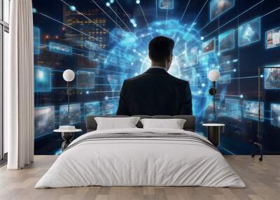 Businessman views digital images on a dark blue background, depicting world maps, intertwined networks, and a virtual world. Abstract concept of technology in business and network connections. Wall mural