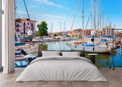 Beautiful scene of boats in Grado, Italy Wall mural