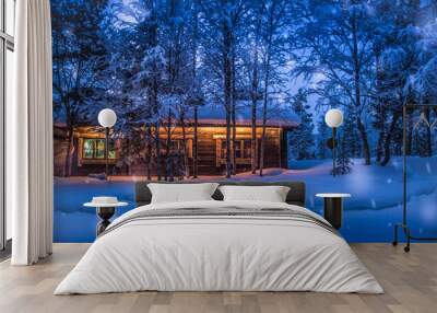 Old wooden forest cabin in winter wonderland scenery at night Wall mural