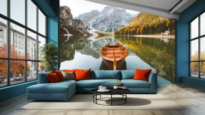 Traditional rowing boat on a lake in the Alps in fall Wall mural