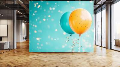 Two colorful balloons with confetti on teal background Wall mural