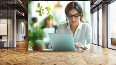 Woman in Office Working on Laptop Wall mural