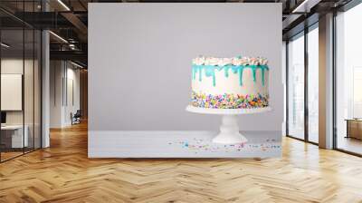 Birthday Cake with a blue ganache drip and colorful sprinkles on a white background Wall mural