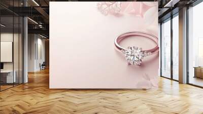 Elegant Diamond Engagement Ring Surrounded by Soft Pink Floral Backdrop Wall mural