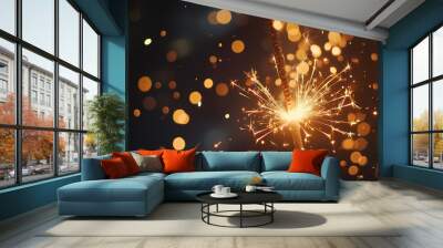 A sparkler emits bright light and sparks among a backdrop of colorful bokeh during a celebration Wall mural