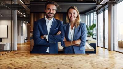 the confines of their office, a male and female business couple share a moment of joy, smiling brightly as they pose for the camera Wall mural