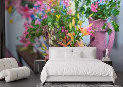 flower arrangement with several vintage vases and a pink couch in an industrial interior Wall mural