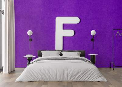 Letter F in wood texture - Purple background Wall mural