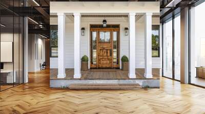 Elegant front porch with white columns, wooden planks, and light wood door frame in coastal Texas architecture. Wall mural