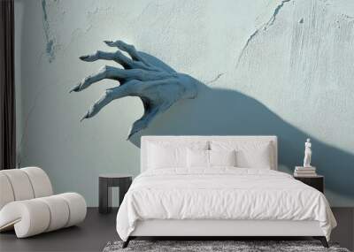 Spooky hand shadow cast on a white wall, creating a Halloween concept with an eerie atmosphere in a close-up view. Wall mural