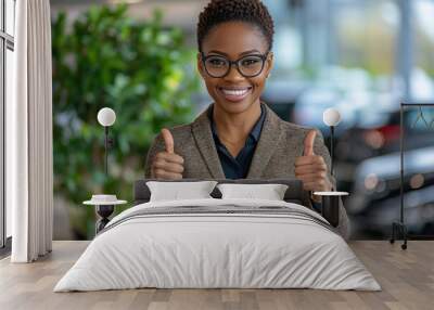 Young African American woman thumbs up in front of the camera Wall mural