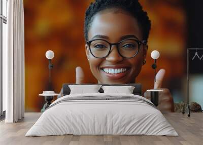 Young African American woman thumbs up in front of the camera Wall mural