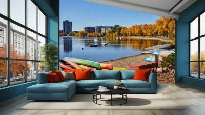 Leaves changing colors and colorful boats on the shore of Bde Maka Ska lake in Minneapolis Minnesota Wall mural