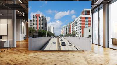 Rows of apartments and condominiums between the Kinney Tunnel at the intersection of Broward Boulevard and US1 in downtown Fort Lauderdale, Florida, USA.  Wall mural