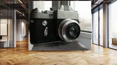  The old Soviet 35mm SLR camera. Retro photo technology on the white background Wall mural